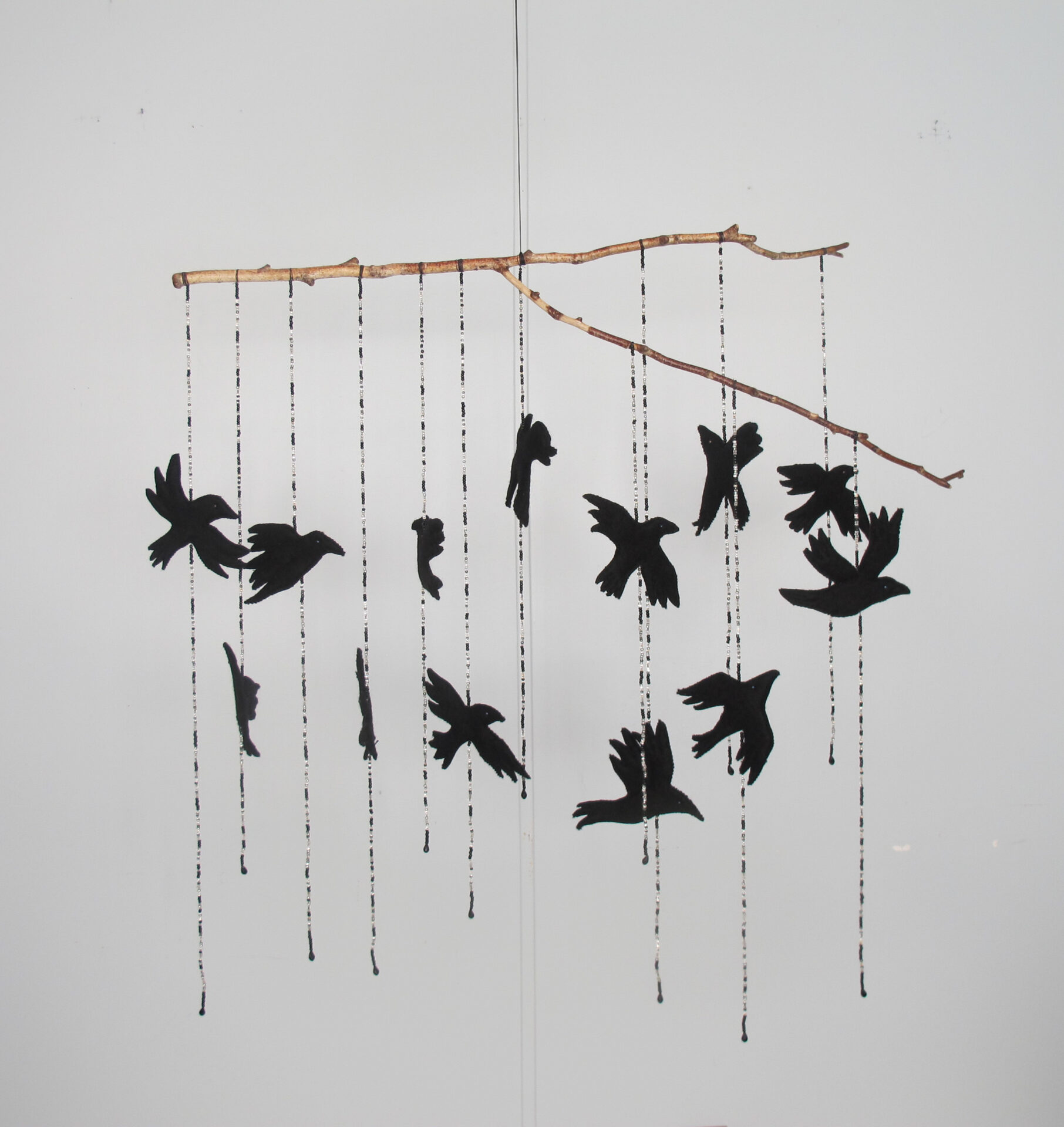 A Murder of Crows -Wool Felt, Beads, Branch 35H x 39W x 7D - 2023