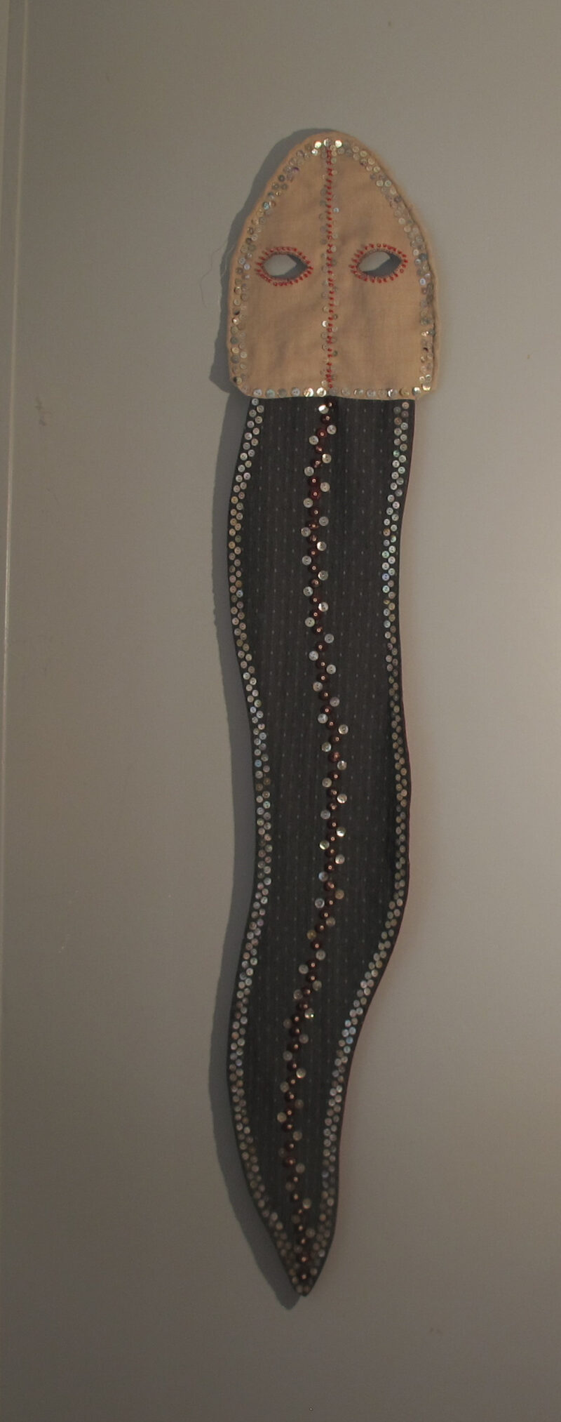 Snake Mask buttons, beads, embroidery on linen 45H x 12W 2021 Collection of Took Gallagher
